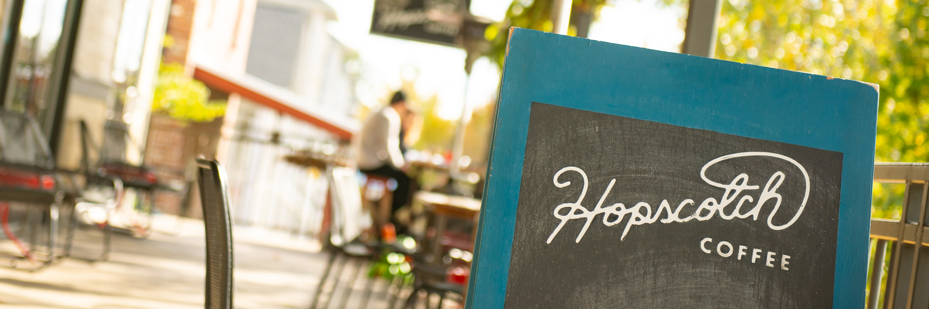 Close up of a sign for Hopscotch Coffee Cafe