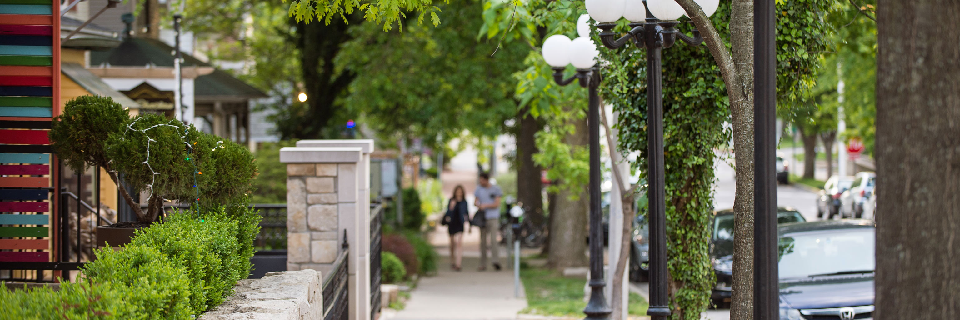 A couple strolling along Fourth Street in Bloomington, Indiana