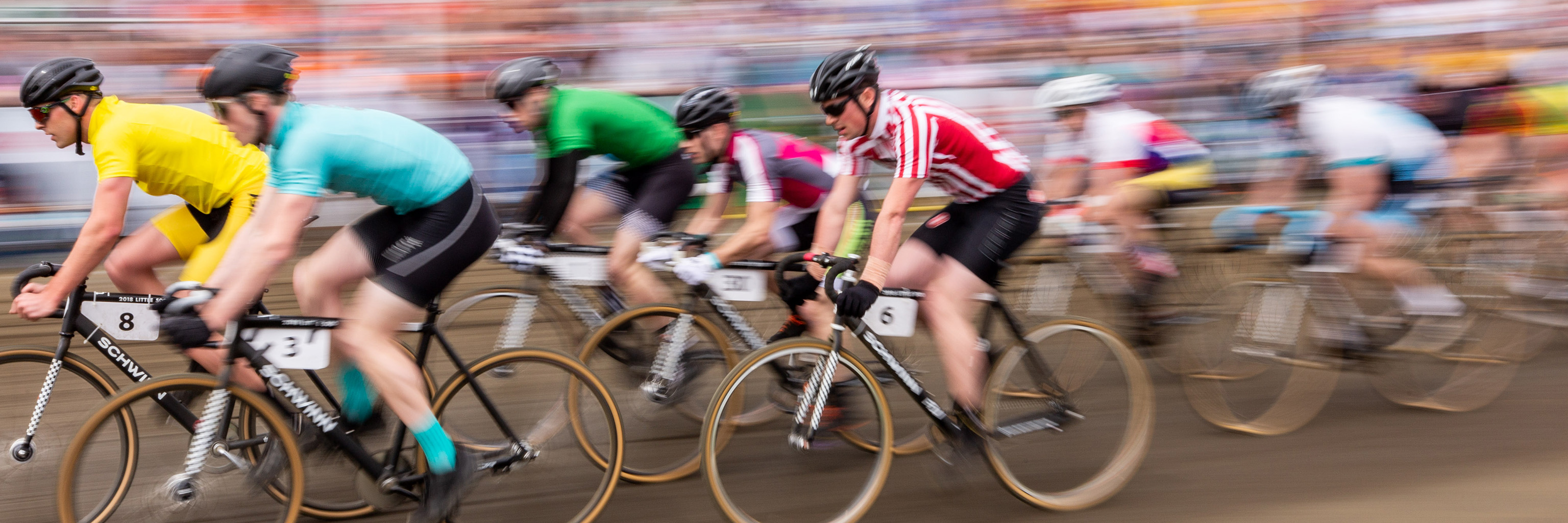 Men racing on bicycles.