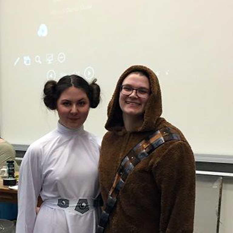Two students dressed up in Star Wars costumes. 